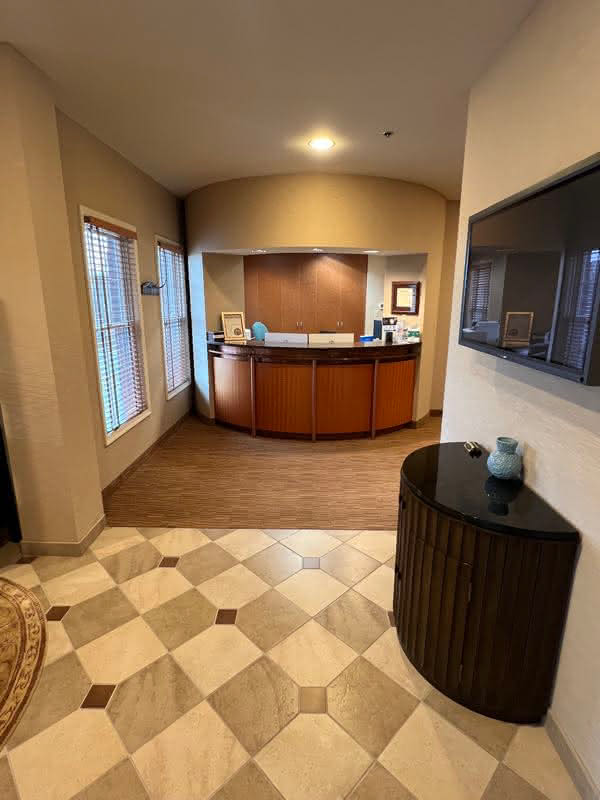 Reception area featuring a wooden desk in the lobby