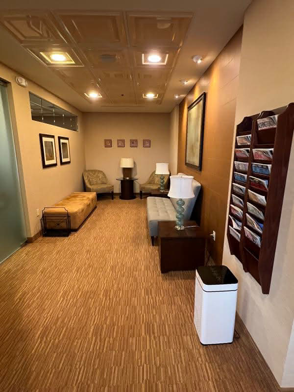 Transitional lounge with comfortable benches in the hallway