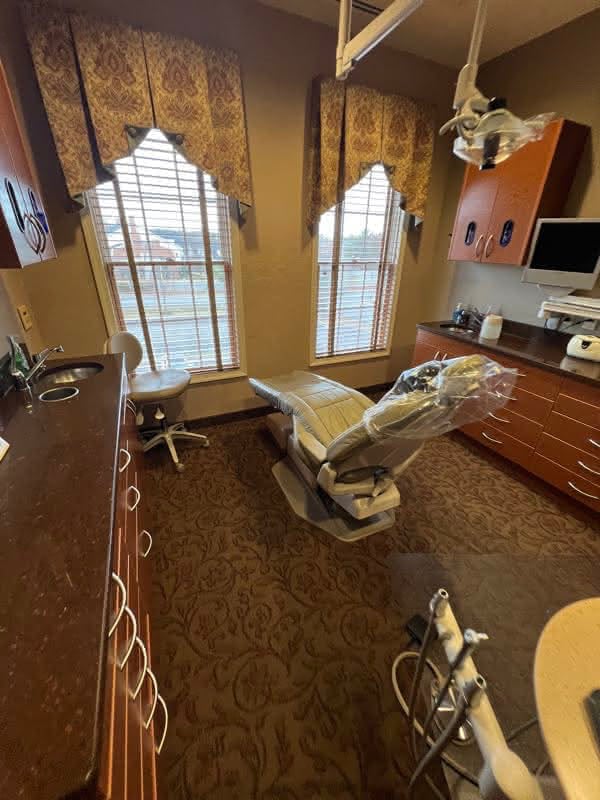 Patient experience area featuring a dental chair in a private exam room